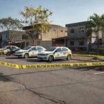 Rua em Samambaia com vagas de estacionamento, cena de briga por vaga que resulta em julgamento por assassinato.